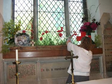 Jo adds the finishing touches to the poppy display