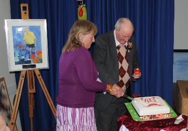 President Ken and Chairman Mary cut the cake
