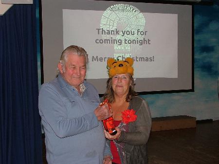 Mary presents our new president with a Christmas gift